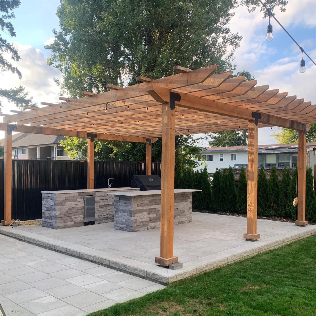 Backyard pergola with barbeque underneath